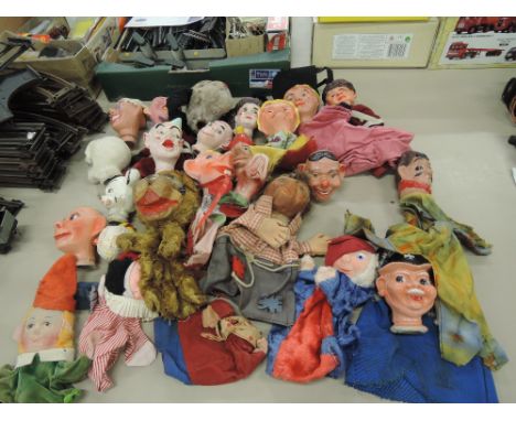 A selection of vintage glove puppets including Chad Valley dog, similar hedgehog, clowns etc
