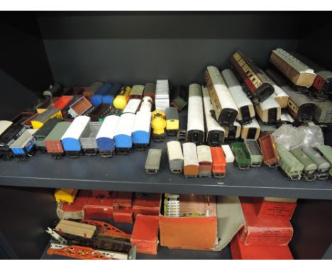 A shelf of Hornby and similar 00 gauge rolling stock and carriages 