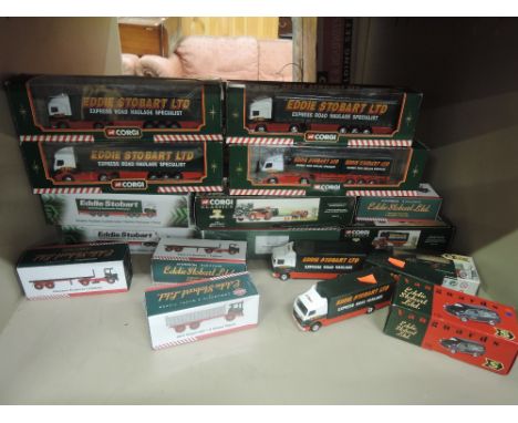 A shelf of diecast Eddie Stobart adverting vehicles including Corgi, Atlas etc all boxed