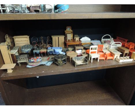 A shelf of vintage wooden and ceramic mixed scale dolls house furniture