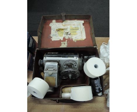 A vintage bus conductors ticket machine 1035 with extra rolls and in fitted carry case