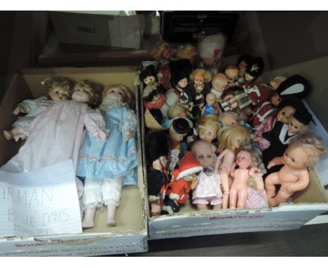 A shelf of 1970's and later celluliod, bisque and similar dolls including Rogart, Hong Kong etc