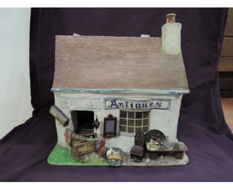 A vintage composition model Antique shop with accessories