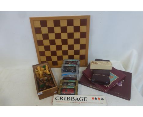 Seven boxed contemporary die cast models, backgammon and mahjong.