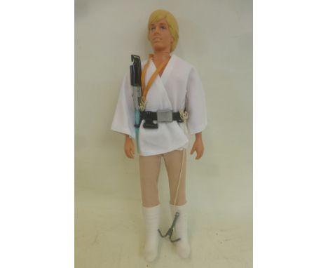 An original Kenner 12" Star Wars figure - Luke Skywalker, complete with medallion, light saber and utility belt in overall ne