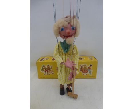 An early 1960s 'Farmer' Pelham Puppet complete with rake and nail prongs, with moving mouth.