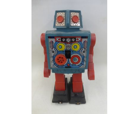 A Japanese part tinplate and plastic 'gear' robot, made by Horikawa.