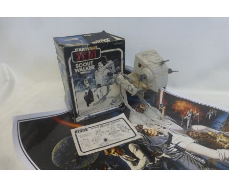 An original boxed Star Wars Return of the Jedi Scout Walker vehicle with instructions; also a Star Wars re-issued 1990s poste