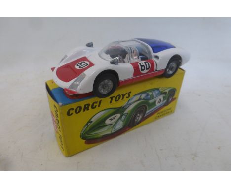 Corgi Toys - Marcos 1800 GT with Volvo engine, no. 324, white with green racing stripes, red interior, in excellent condition