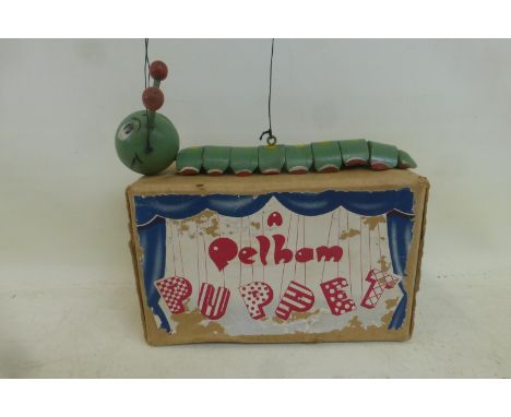 An early boxed Pelham Puppet: Caterpillar, green, circa early 1950s, with original tissue paper, with antennae.