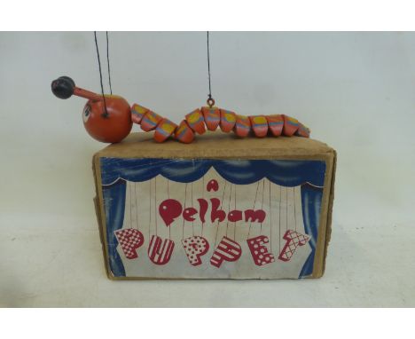 An early boxed Pelham Puppet: Caterpillar, orange, circa early 1950s, with original tissue paper, with antennae.