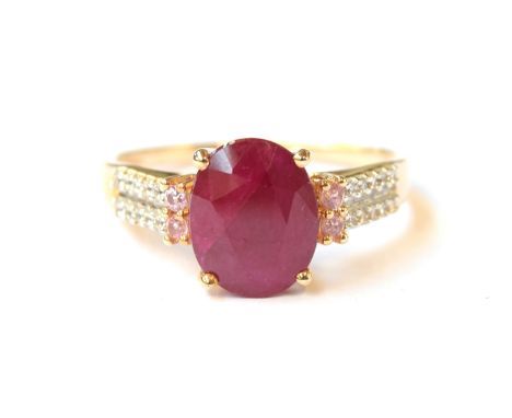 A 9ct gold ring set with a ruby, pink sapphires and natural zircon, the Burmese ruby 3.2g, size Q, 2.8g 