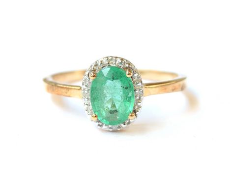 A 9ct gold, emerald and diamond cluster ring, the Zambian emerald 1.1cts and 8x6mm, surrounded by 0.03cts of diamonds, size P