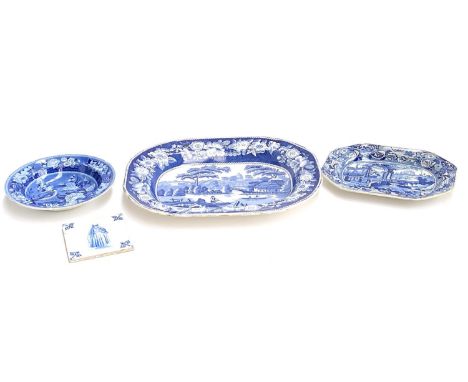 A large 19th century blue and white meat plate, 46cmW, a smaller blue and white bowl, and a Delft tile depicting a woman, 13x