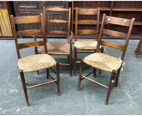 Three ladder back side chairs with rush seats; together with an open armchair with rush seat 