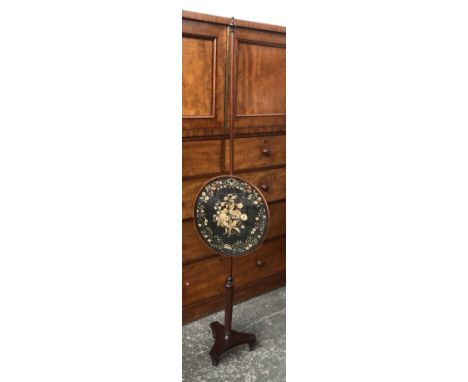 A Regency pole firescreen, with floral needlework roundel, 158cmH 