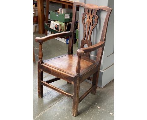 A George III provincial elm splat back commode open armchair