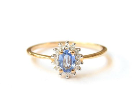 A 9ct gold sapphire and white zircon cluster ring, the Ceylon sapphire 0.6cts, size S, 1.9g 