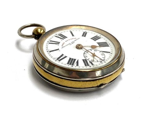 A silver plated pocket fob watch with engine turned detail, enamel dial signed John Russell, 5.2cmD 