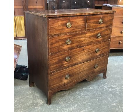 A Regency mahogany and line inlaid chest of two short over three long drawers, on shaped apron and swept bracket feet, 115x54