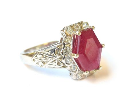 A sterling silver ring set with a Cabo Delgado ruby, surrounded by natural zircons, the ruby 5.1cts, size P