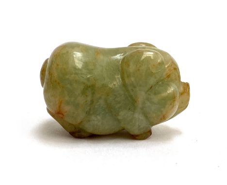 A small Chinese well carved jade figurine of a pig, 5cm long 
