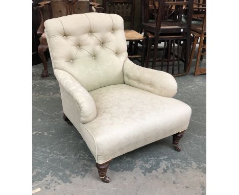 A good Victorian button back armchair, on turned front legs and ceramic casters, the back leg number stamped, 68cmW 
