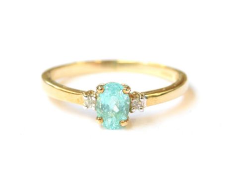 A 9ct gold ring set with a paraiba tourmaline and white sapphires, the Brazilian tourmaline 0.5cts, size N 1/2, 1.6g 