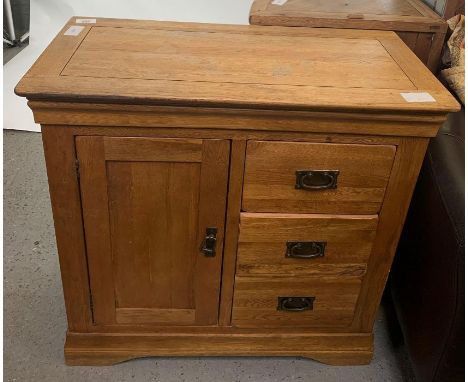 Modern light oak cupboard with single drawer opening to a loose shelf and 3 short drawers to the other half