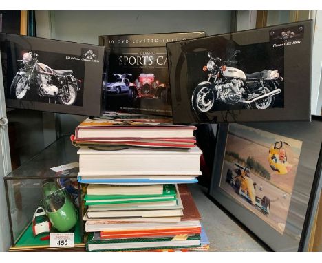 Shelf of motorcycle books, boxed car/cycle scale models