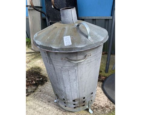 Galvanized incinerator together with a chrome kitchen shelf