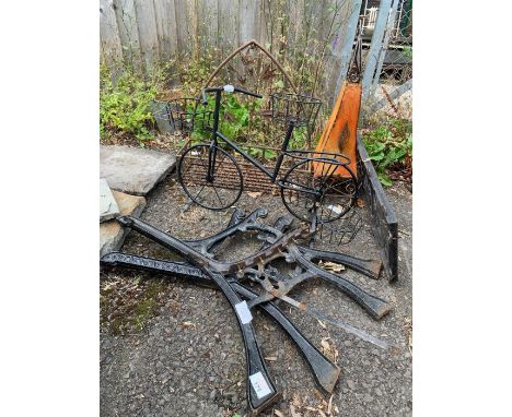 Pair of black painted bench ends together with novelty bicycle garden planter, another garden planter &amp; another item