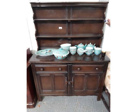 An Ercol style dark wood dresser