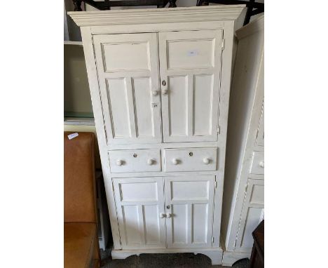 Modern white painted pine cupboard, 2 drawers to the top, opening to a single fixed shelf, 2 drawers below and a 2 door cupbo