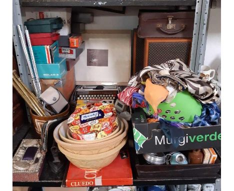 Shelf of items to include large collection of slides, mixing bowls, 2 speakers, scarves, cased Brother typewriter etc