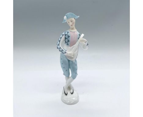Part of the Teenagers series. Hand painted glaze figure of a harlequin in blue playing the mandolin. Royal Doulton backstamp.