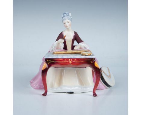 This fine bone china figure depicts a woman playing a dulcimer, known for its graceful and elegant design. It is part of the 
