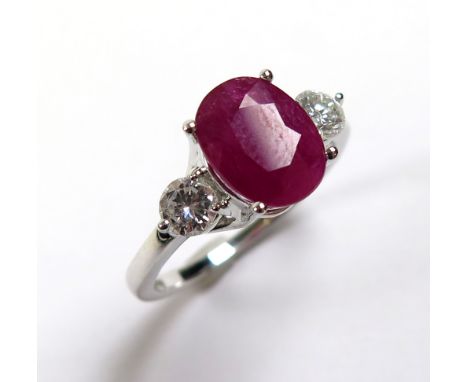 18ct White Gold Ring with central Ruby 2.45 ct weight and 2 Diamond shoulders 0.52 ct weight size M weight 3.9 grams