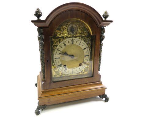 Large wooden cased mantle clock (approx 34cm tall) black roman numerals on an ornate gilt dial