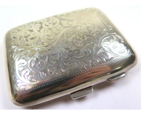George V silver cigarette case of curved rectangular form engraved with scrolling foliage by J W Tiptaft, Birmingham 1927. Ap