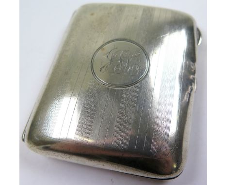 George V silver cigarette case of curved rectangular form, the engine turned case with monogram to centre by Clark & Sewell, 