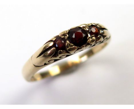 9ct Gold ring set with 3 Garnets size O weight 2.4 grams