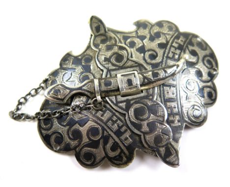 Silver Belt Buckle with black enamelling fastened by means of an ornate Dagger