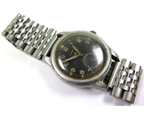 British Military issue Timor W.W.W. stainless steel manual wristwatch. The black dial having the arrow mark, , Arabic numeral
