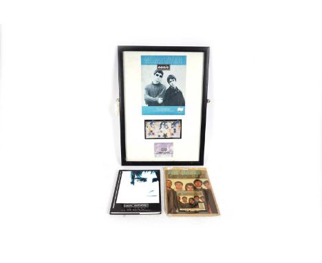 Oasis memorabilia and ephemera, to include: a framed songbook for Whatever, a ticket stub from the 1997 Newcastle Arena show,