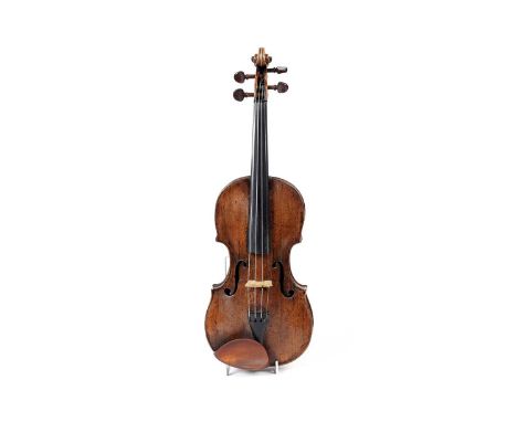 A mid to late 18th Century German violin, with two-piece lightly figured back and ribs, scroll carved button, medium light va