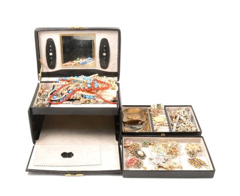 A three tier black jewel box with vintage costume jewellery, a collection of paste set brooches, one by Attwood &amp; Sawyer;