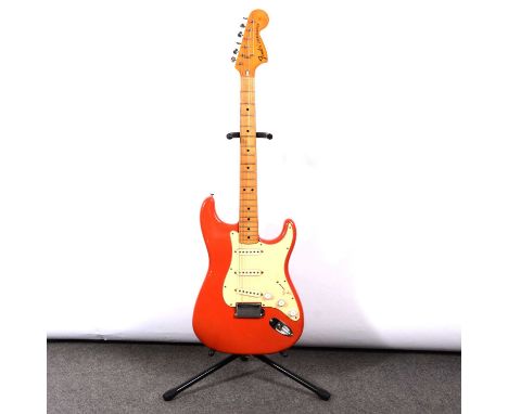 Fender Stratocaster electric guitar, made in USA, date 1973, serial number 399654, red/orange body, with original owner's man