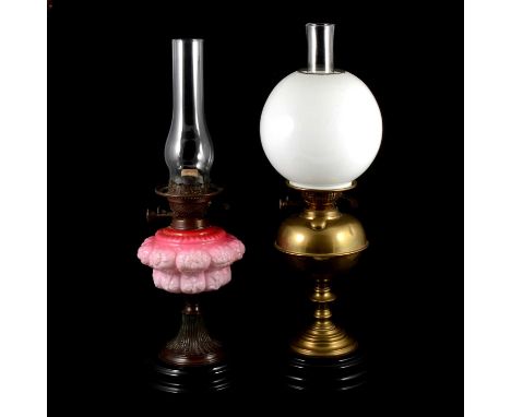 Edwardian oil lamp, moulded pink glass reservoir, no shade, 58cm to chimney, and another Edwardian brass oil lamp with globe 