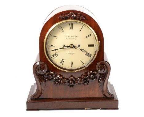 Victorian mahogany mantel clock, James McCabe, domed case with scrolled sides, applied carvings of flowers, plinth base, circ